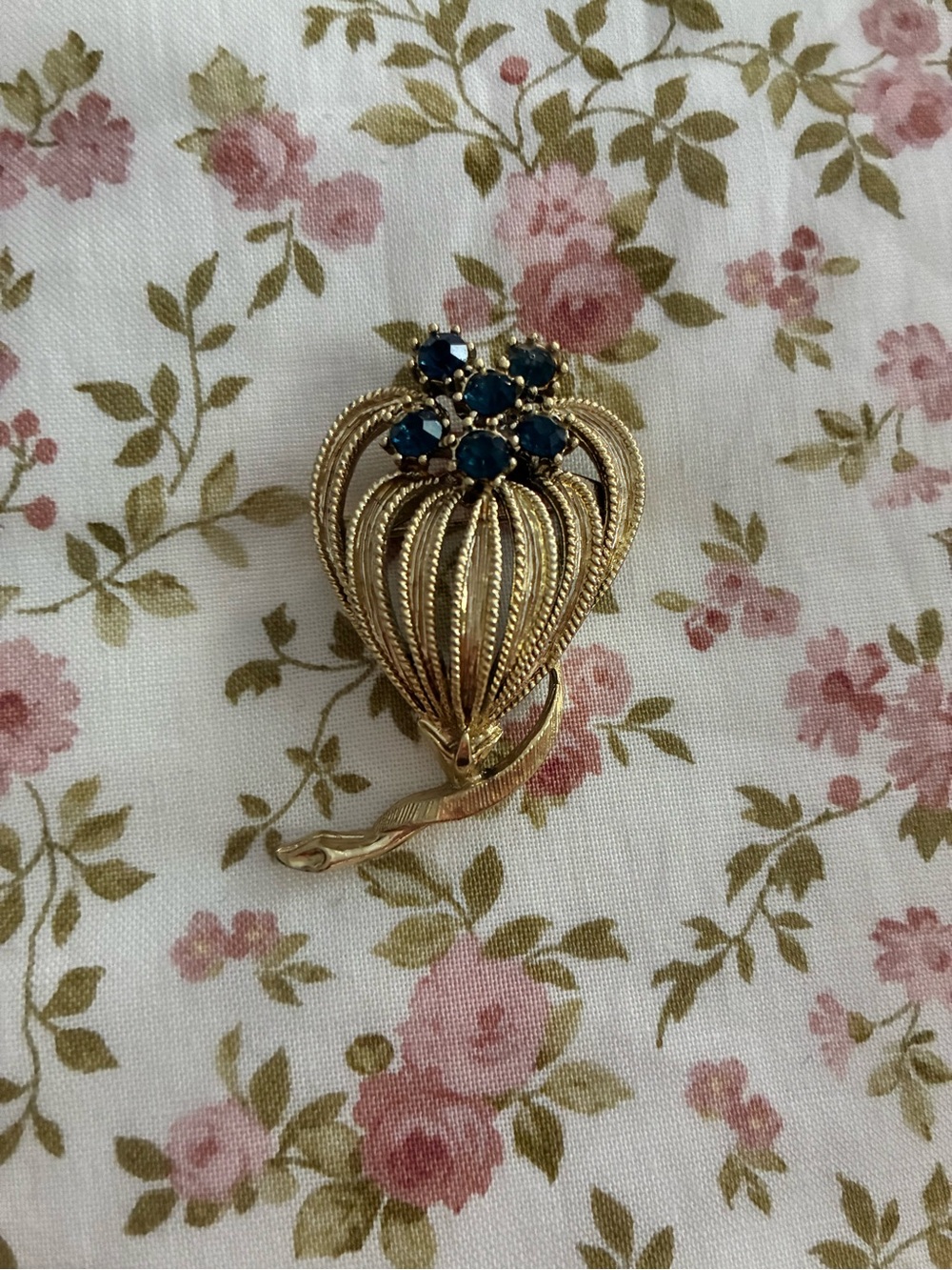 Gold-Tone Floral Brooch with Deep Blue Stones.